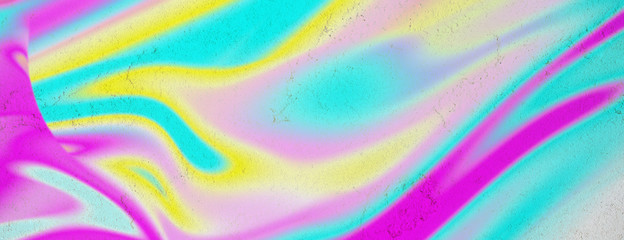 Abstract concept with neon colorful fluid art on concrete background. Digital modern art. Flowing blue, green, pink, yellow and purple colors.