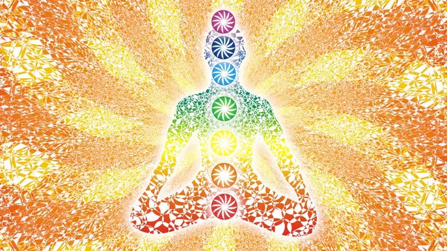 Silhouette of a yogi on the background of the openwork rotating mandala. Seamless looping. Video art picture.