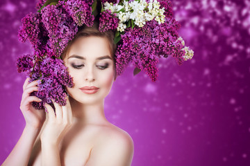 Spring woman portrait. Beauty girl with colorful wreath of lilac flowers in her hair.