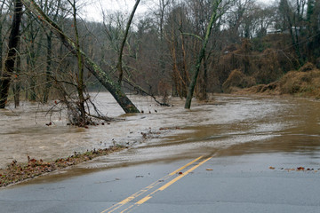 Flooding River Overflows Onto a Road