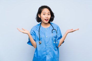 Surgeon doctor woman with shocked facial expression