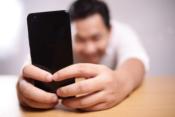 Businessman Holding and Using Smart Phone