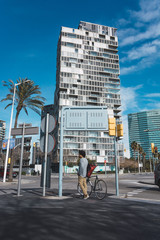 Man with afro hair riding a vintage style bicycle