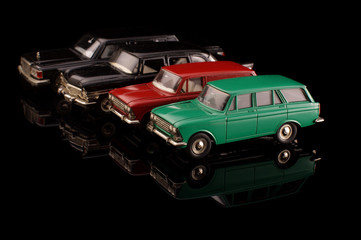 Obraz na płótnie Canvas Old vintage die cast car model collection isolated on the black background