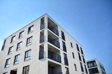 Fototapeta premium Multistory new modern apartment building. Stylish living block of flats.