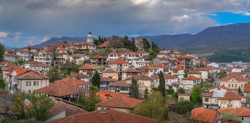 Fototapeta na wymiar Hillside red tiled rooftops of houses in Ohrid