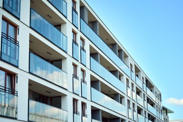 Multistory new modern apartment building. Stylish living block of flats.