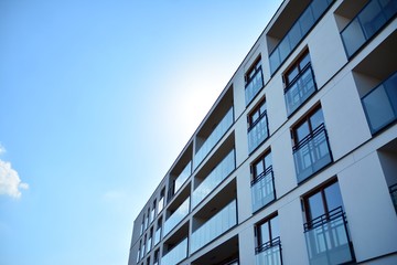 Multistory new modern apartment building. Stylish living block of flats.