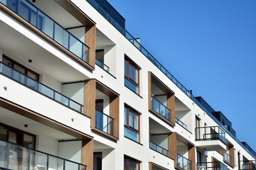 Multistory new modern apartment building. Stylish living block of flats.