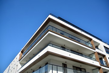 Multistory new modern apartment building. Stylish living block of flats.