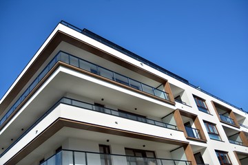Multistory new modern apartment building. Stylish living block of flats.