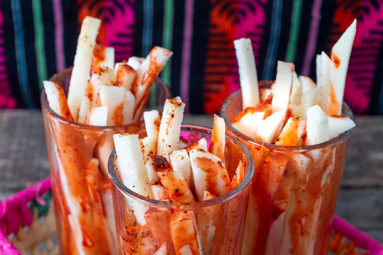 Mexican Jicama Fruit Cutted With Lime, Chili Powder And Chamoy