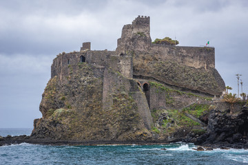 Fototapeta na wymiar View from pier on castle built in 1076 by the Normans in Aci Castello town on Sicily Island in Italy