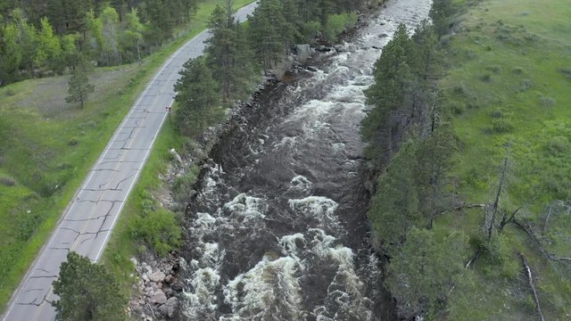 aerial view of a mountain river with high spring flow - the Poudre River in northern Colorado