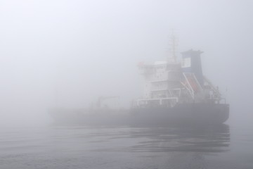 Tanker ship in the dense fog.