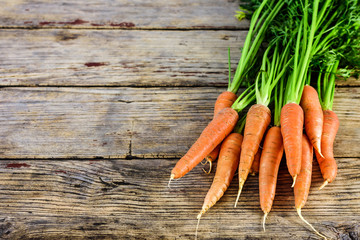 Fresh carrot on a wooden table