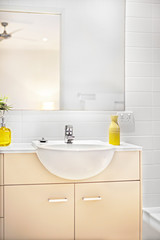 Sink and a tap with a mirror on the wall
