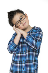 Little kid in glasses feels sleepy on isolated white background with blue shirt