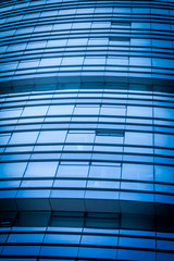 Fototapeta na wymiar Blue glass office building