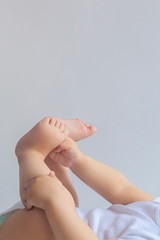 6-month kid feet. Little baby boy feet. Childhood, motherhood, life style upbringing concept