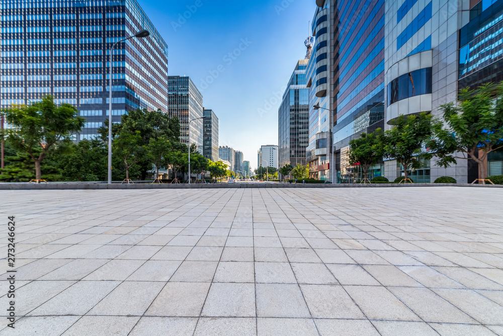 Wall mural Panoramic skyline and modern business office buildings with empty road,empty concrete square floor