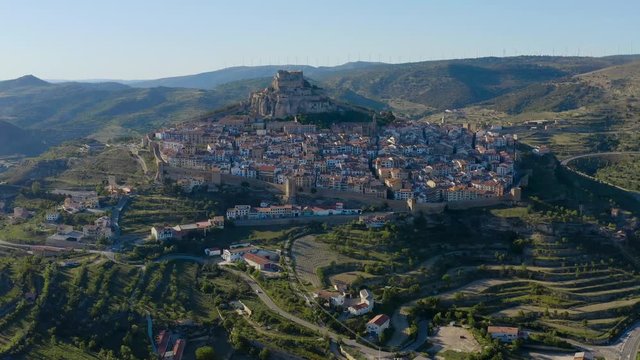 Flight from meadows, crossing Morella village, to ancient Castle located on the top of the hill. Castle and town is a giant fort. Castellon province, Valencia, Spain