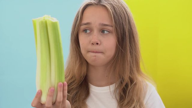 Concept of healthy and unhealthy food.Beautiful woman face choice food. Healthy natural vegetables or sweet dessert concept. Healthy vs junk food