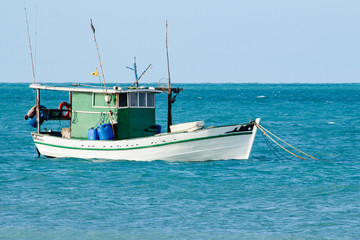 Fisherman's boat. Sailing the wind through the waves at sea.