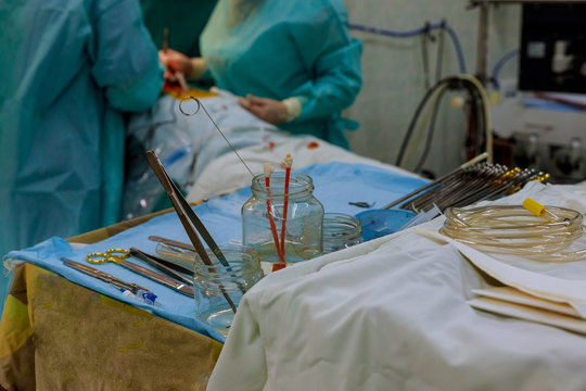 Medical team performing operation close up of medical instruments for operation