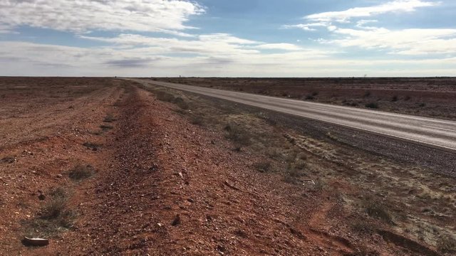Abandoned car on Stuart highway in Central Australian desert outback. 