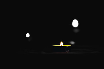 Candles burn in memory of the dead