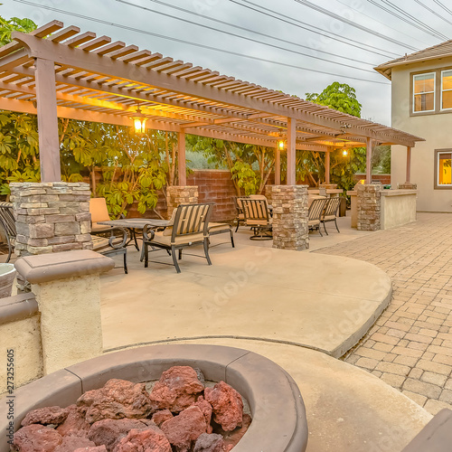 Square Frame Patio With Dining Area And Built In Circular Benches