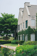 Beautiful decoration of English country style building covered with green creeper plant