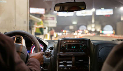 Driving in New York at night. Interior view of taxi cab in traffic.