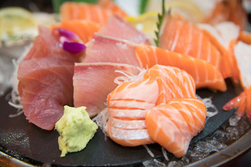 sashimi set with different fresh fish sliced on plate
