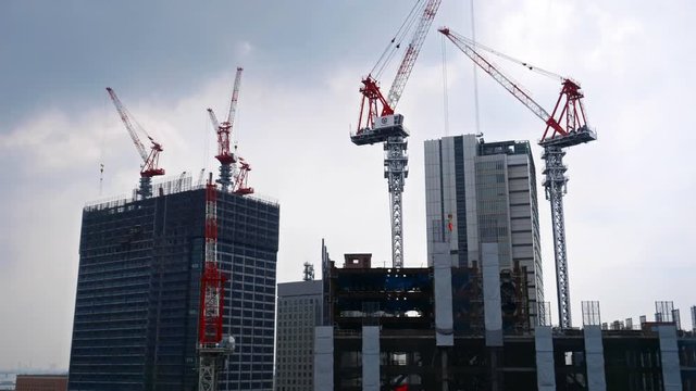 Cranes working on construction of highrise buildings in Tokyo CBD, Japan
