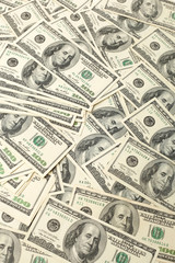 Canvas money sack with one hundred dollar bills 