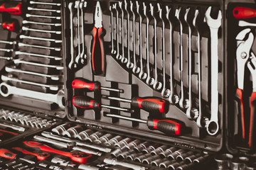Mechanic essential instruments. Closeup of chrome wrench tools organized in box.