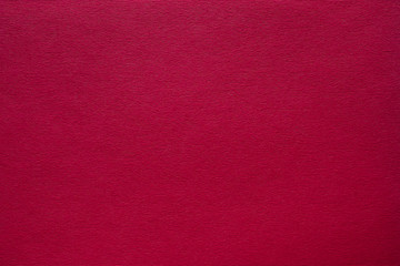 Maroon red felt texture abstract art background. Corduroy textile pattern surface. Copy space.