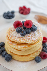 Delicious home made sweet vanilla pancakes with berries