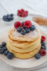Delicious home made sweet vanilla pancakes with berries