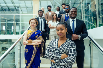 Asian business person in multiracial. Diversity business people form by different races, Indian, Malay, Indonesian, Chinese and African in modern room shopping mall