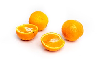 isolated on a white sprinkled water background, fresh, juicy orange fruits