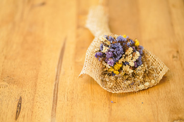Beautiful dried flower bouquet placed on a wooden table, a bouquet of flowers for congratulations on various occasions.