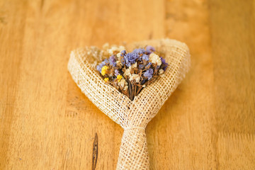 Beautiful dried flower bouquet placed on a wooden table, a bouquet of flowers for congratulations on various occasions.