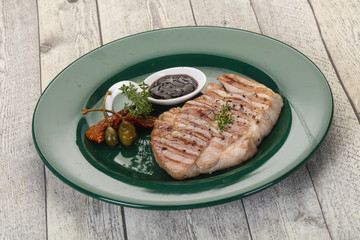 Grilled pork steak with pepper sauce