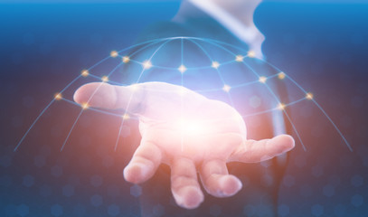 Businessman holding global network and data exchanges over the world. Technologies connecting the world. Businessman in suit holding global connection symbol on his hand