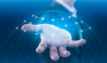 Businessman holding global network and data exchanges over the world. Technologies connecting the world. Businessman in suit holding global connection symbol on his hand