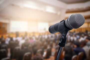Microphone over the blurred business people forum Meeting Conference Training Learning Coaching Concept, Blurred background. - obrazy, fototapety, plakaty