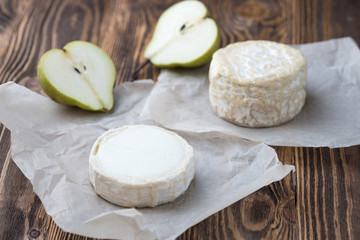 Fototapeta na wymiar Goat soft cheese with slices of pear, Healthy snack cheese